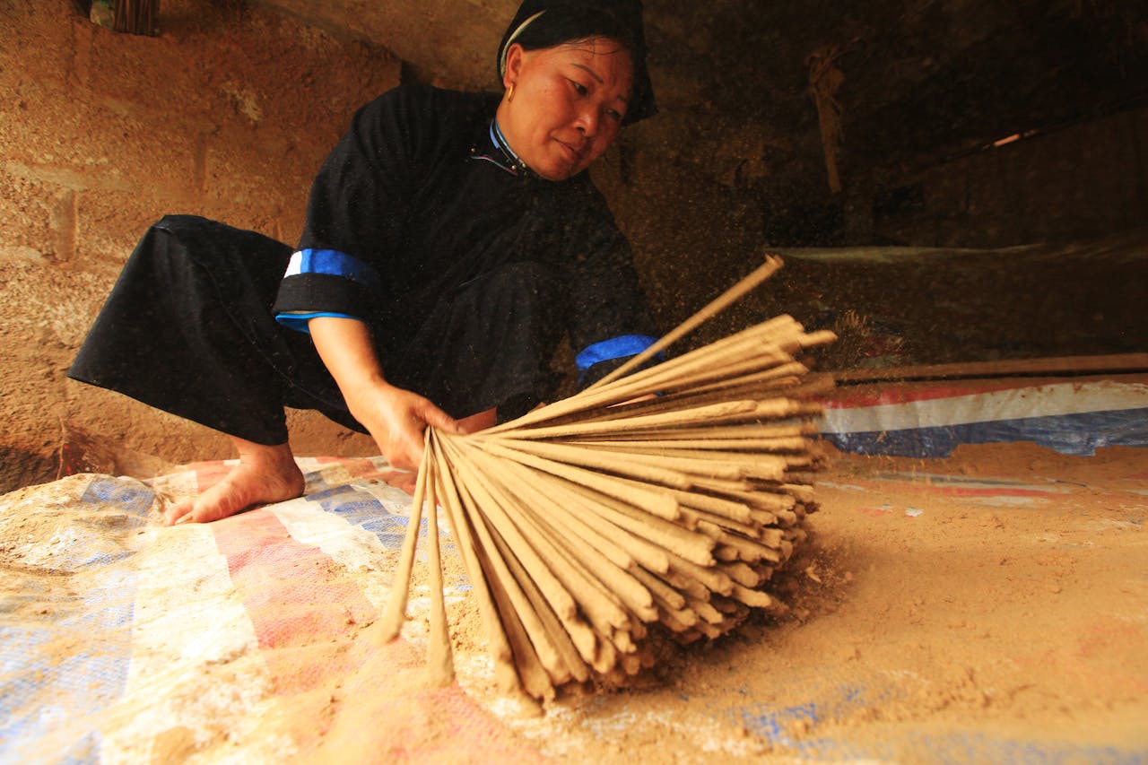A woman working on traditional incense sticks crafting in Cao Bằng, Vietnam.